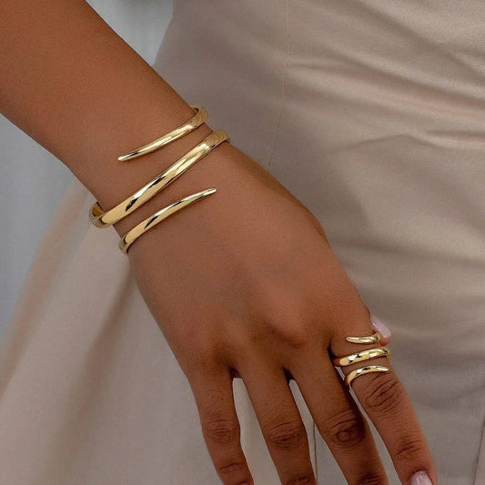 A bold gold-color geometric bracelet and ring