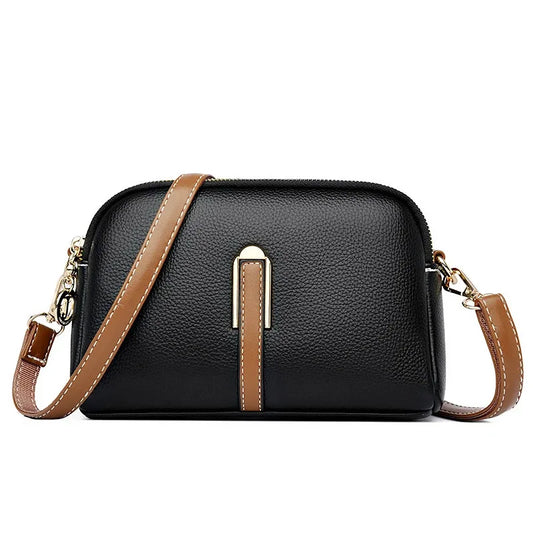 Designer cowhide messenger bag for women.
