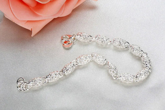 Women's Sterling Silver Geometric Charm Bracelet with Zirconia. A lucky and fashionable gift idea.