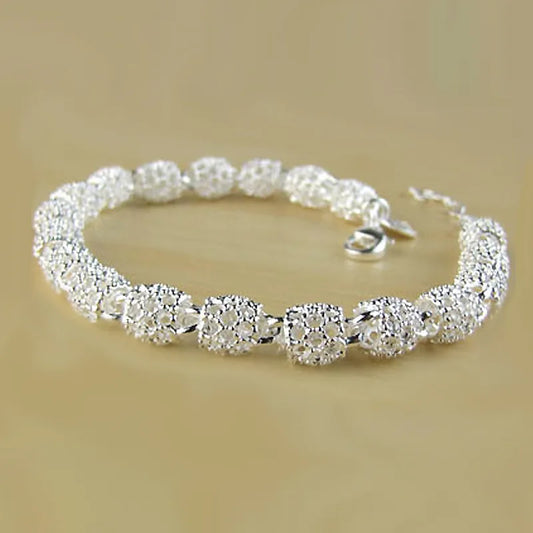 Women's Sterling Silver Geometric Charm Bracelet with Zirconia. A lucky and fashionable gift idea.